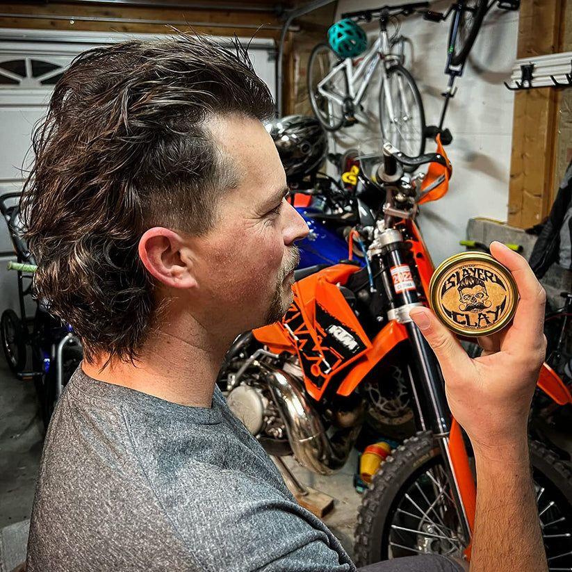Death Grip Slayer Organic Hair Clay by Pasteur Pharmacy in 2 oz jar, medium hold for textured, styled hair.
