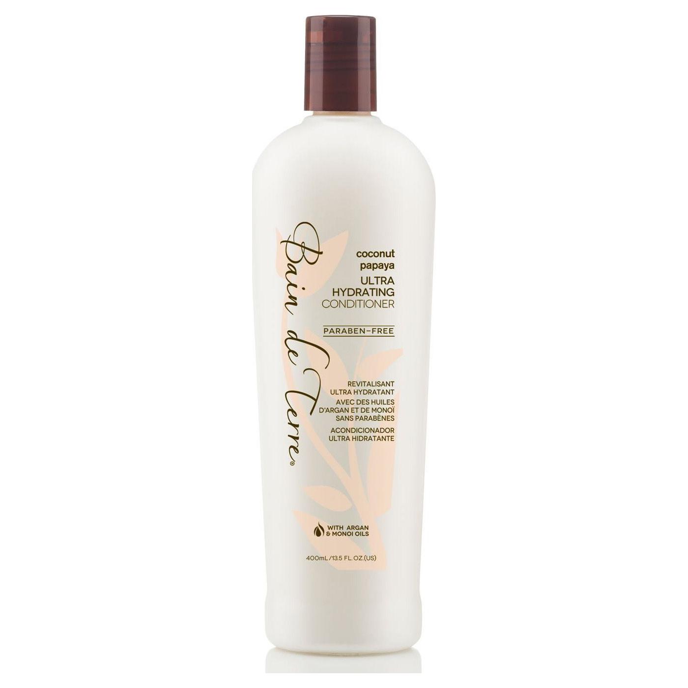 Bain De Terre Ultra Hydrating Coconut Papaya Hair Conditioner in 13.5 fl oz bottle, nourishing for dry and damaged hair.