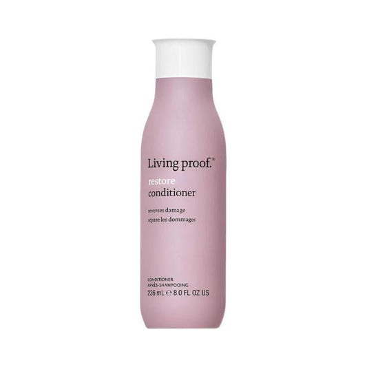 Living Proof Restore Conditioner 8 oz bottle, creamy hair conditioner for damaged hair, shown in a white and blue bottle.