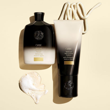 Oribe Gold Lust Repair & Restore Hair Conditioner in 200ml bottle, creamy formula for nourishing and restoring damaged hair.