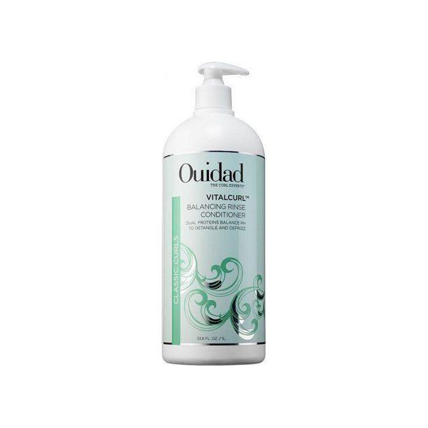 Ouidad Vitalcurl Balancing Rinse daily conditioner for curly hair in a 33.8 oz bottle, designed to hydrate and define curls naturally.