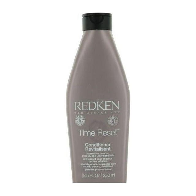 Redken Time Reset conditioner in a 8.5 fl oz bottle, designed to nourish and restore aging hair with a smooth, healthy finish.