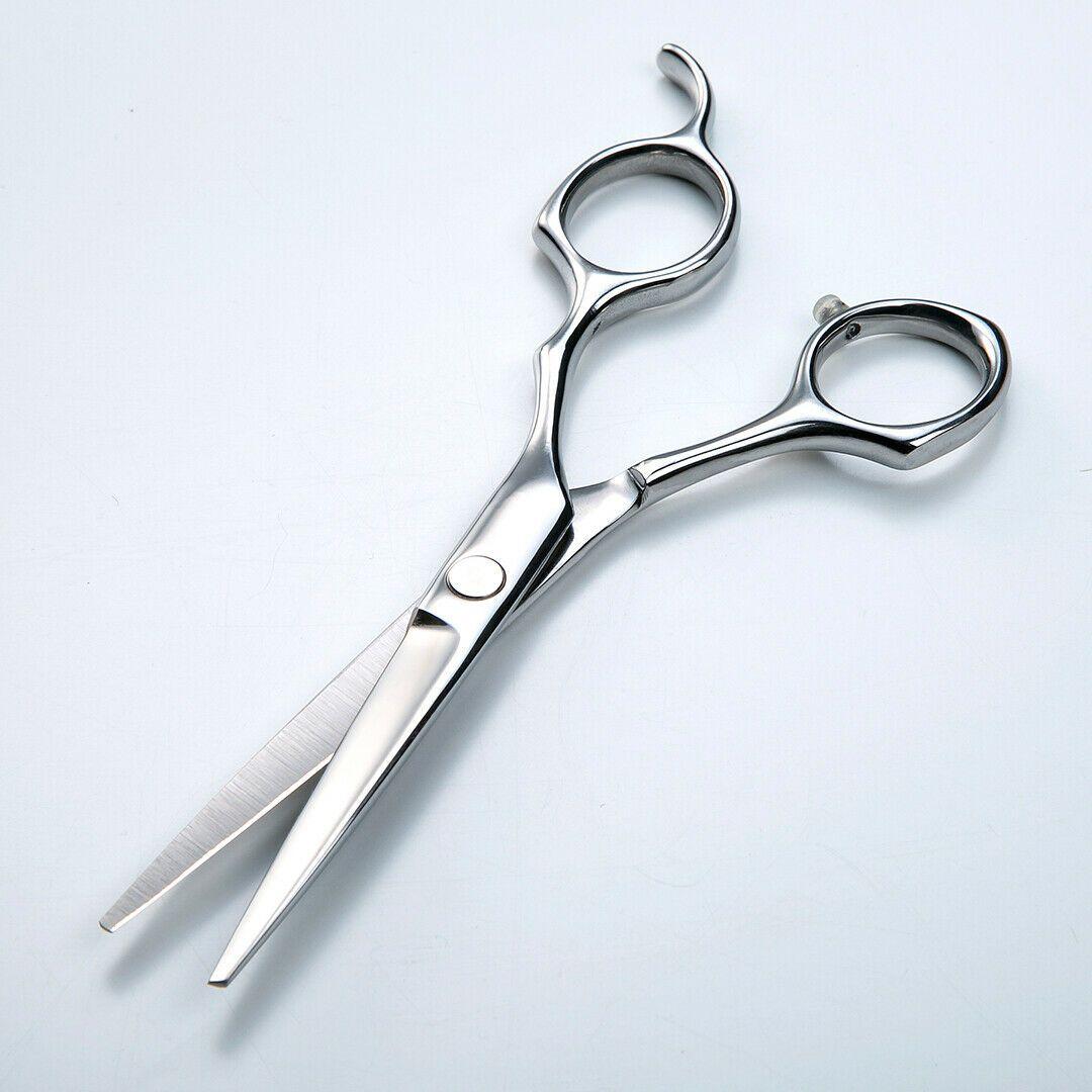 Seki Edge SS-703 stainless steel hair cutting scissors with ergonomic handles, designed for precise hair trimming.