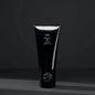 Oribe Rock Hard Gel 100ml hair gel in a clear jar with a black lid, designed for strong hold and styling control.