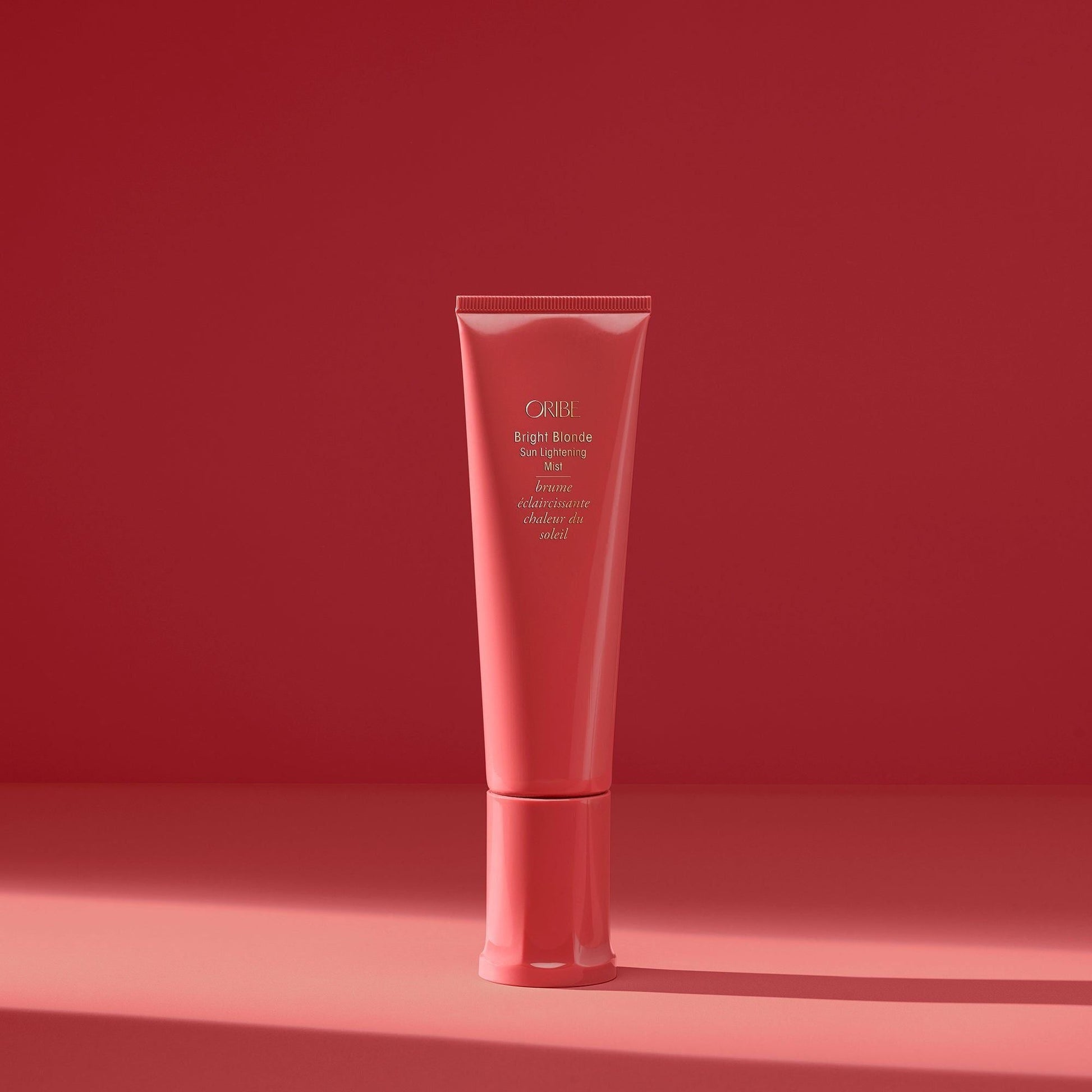 Oribe Bright Blonde Sun Lightening Mist in a 90 ml spray bottle, designed to brighten and lighten blonde hair naturally.