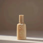 Oribe Matte Waves Texture Lotion 100ml, a hair lotion for tousled, matte-finish waves, shown in a sleek bottle.