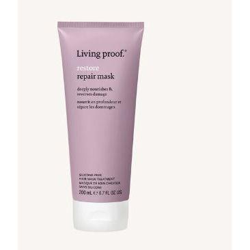 Living Proof Restore Hair Mask Treatment 1 oz in a white jar with a black lid, designed to nourish and repair damaged hair.