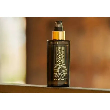 Sebastian Professional Dark Hair Oil 95ml in a clear bottle, designed to nourish and add shine to dark hair.