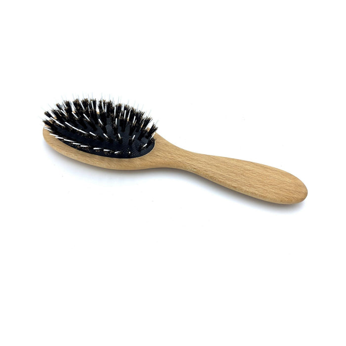 Dural Hair Brush by Pasteur Pharmacy with wild boar bristles, rubber cushion, and beech wood styling pins for hair styling and care.