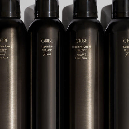 Oribe Superfine Hair Spray 300 ml bottle, lightweight styling spray for hold and volume, displayed on a clean surface.