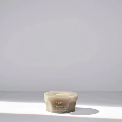 Oribe Fiber Groom Elastic Texture Paste 50ml hair styling paste with flexible hold and natural finish, shown in a sleek container.