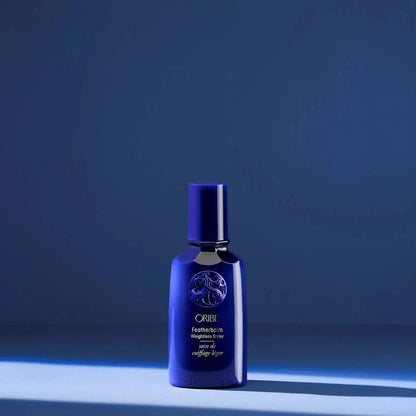 Oribe Featherbalm Weightless Styler 100ml hair styling product for lightweight, manageable hair, shown in a sleek bottle.