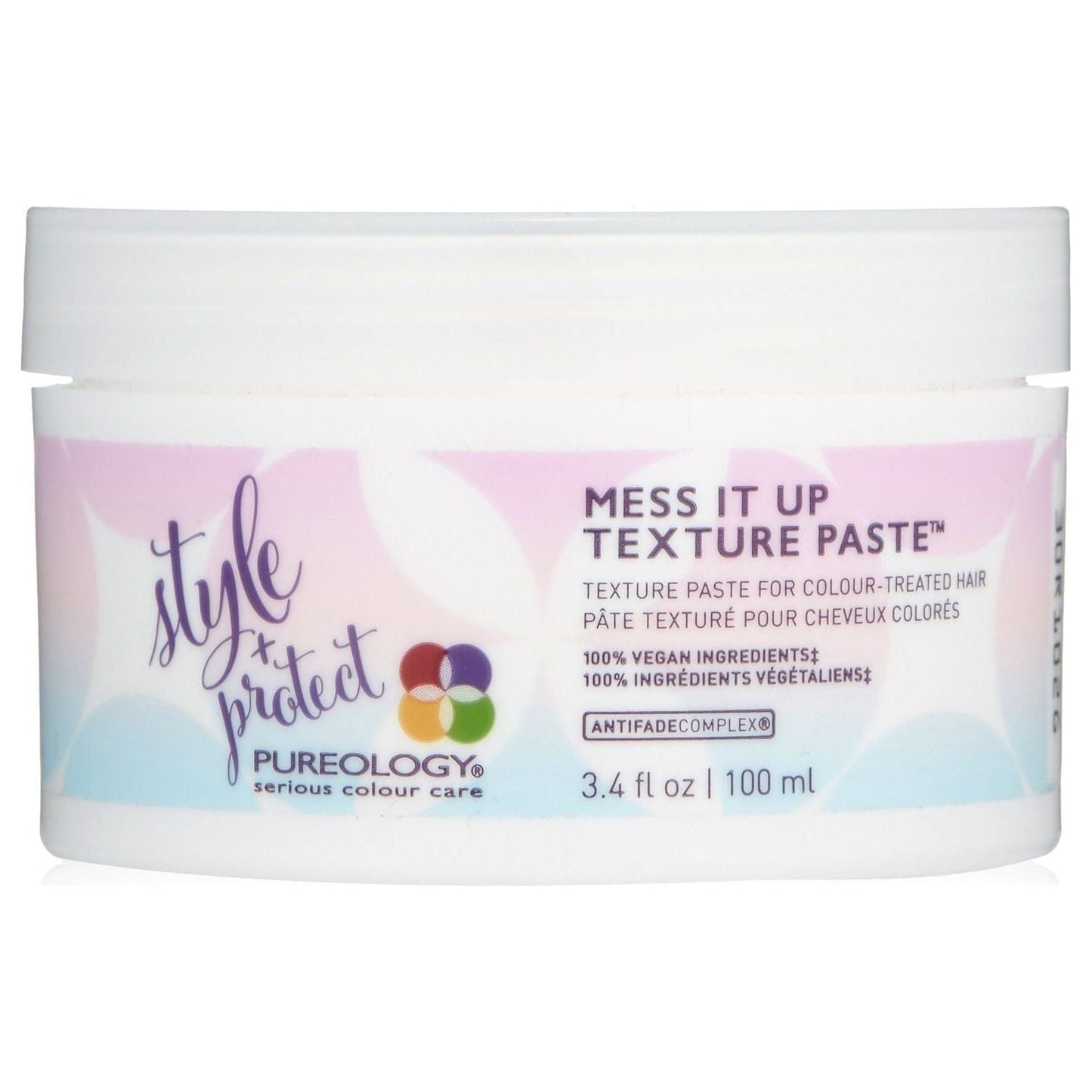 Pureology Style + Protect Mess It Up Texture Paste in 3.4 oz jar, ideal for styling and texturizing hair.