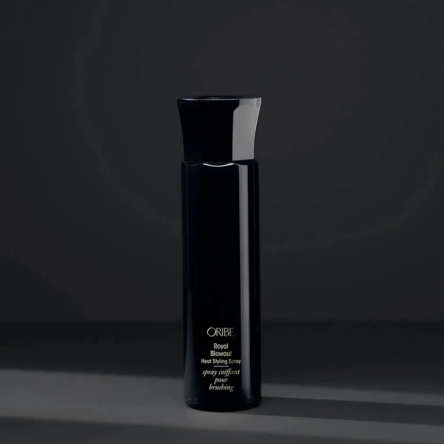 Oribe Royal Blowout Heat Styling Spray in 175ml bottle, a hair styling spray for smooth, shiny hair.