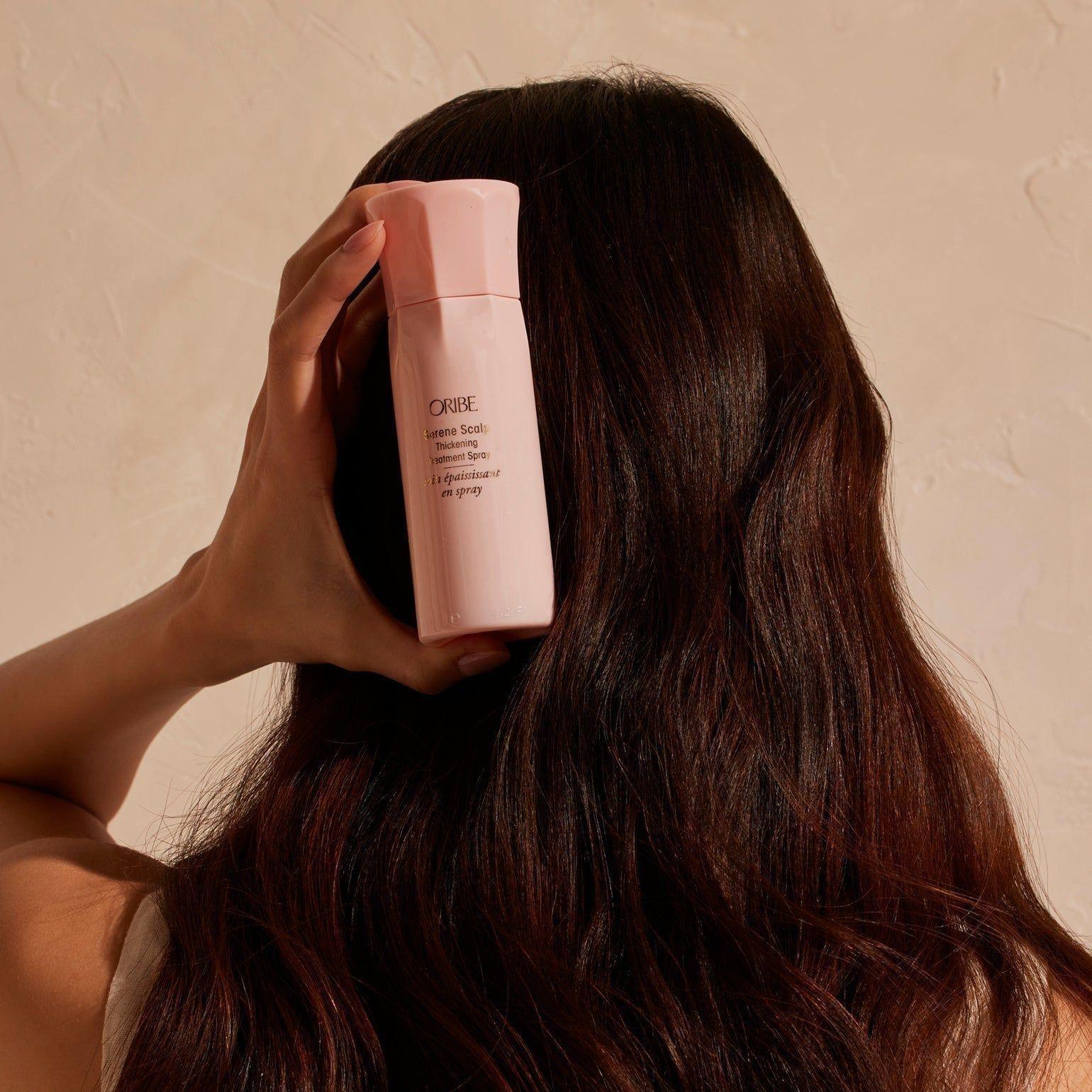 Oribe Serene Scalp Thickening Treatment Spray in 125 ml bottle, a hair treatment spray for scalp and hair volume.