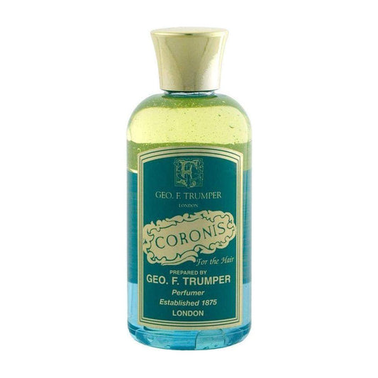 Travel-size 100ml Geo. F. Trumper Coronis Hairdressing by Pasteur Pharmacy, featuring a clear bottle with product label and cap.