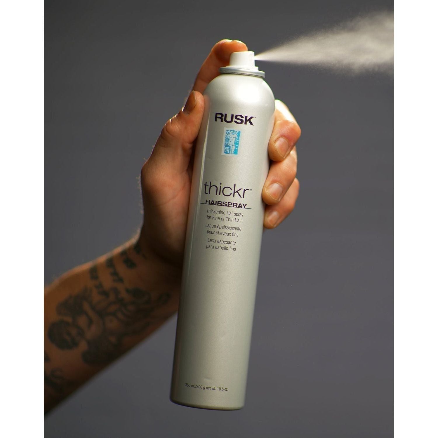 Rusk Thickr Hairspray for fine hair in a 360 mL spray bottle, providing hold and volume for delicate hair types.
