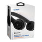 Wireless black Coby Electronics foldable headphones with compact design, shown in a natural view.