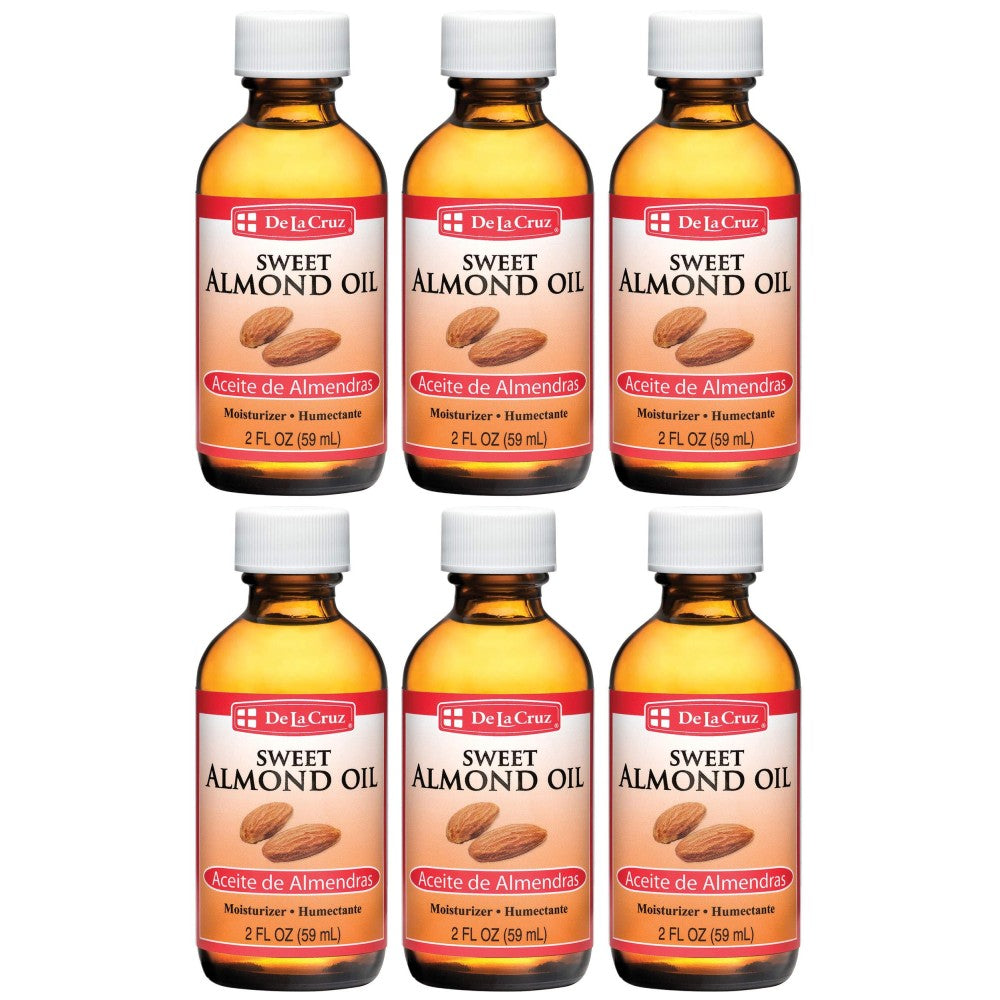 De La Cruz Sweet Almond Oil 2 oz in a clear bottle, natural health and beauty product for skin and hair care.