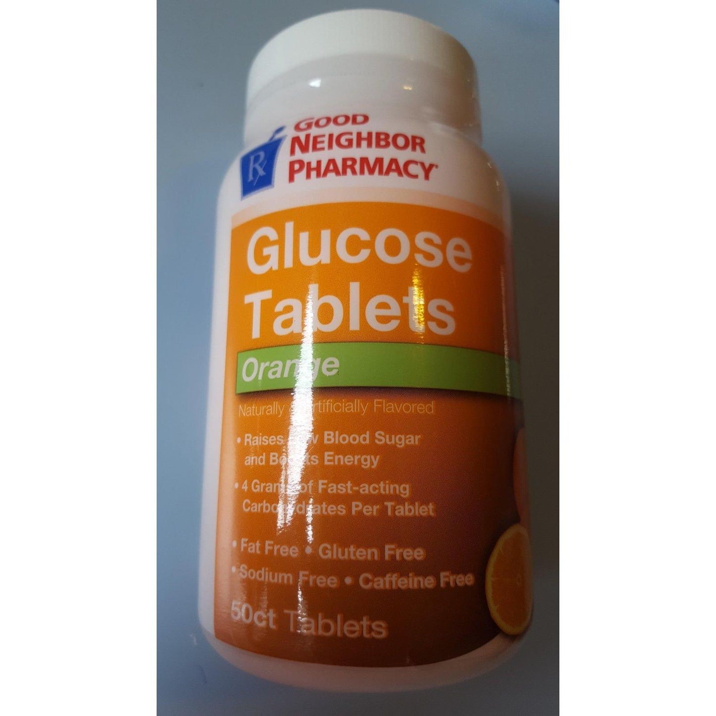 Orange glucose tablet from Good Neighbor Pharmacy GNP, by Pasteur Pharmacy, in a clear blister pack for quick energy support.