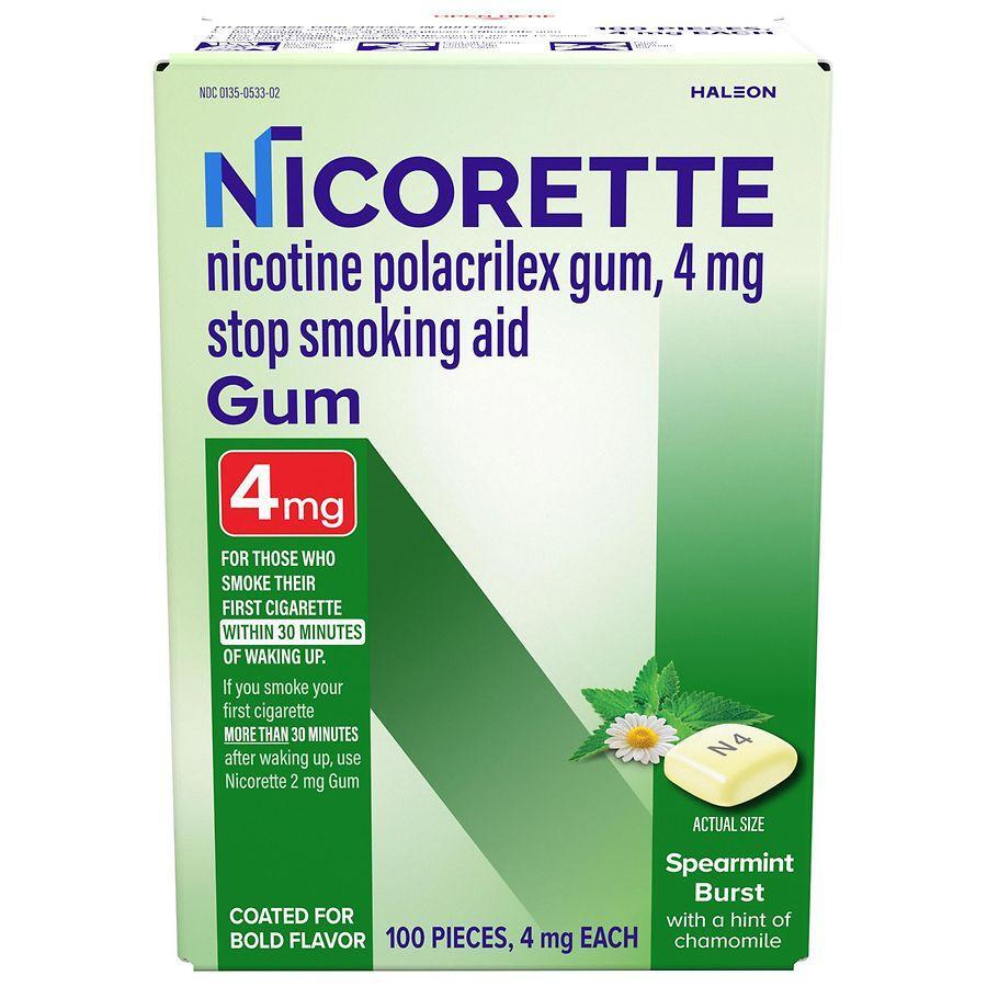 Nicorette nicotine stop smoking aid gum in spearmint flavor, 4 mg, for smoking cessation, displayed in a package with fresh mint leaves.