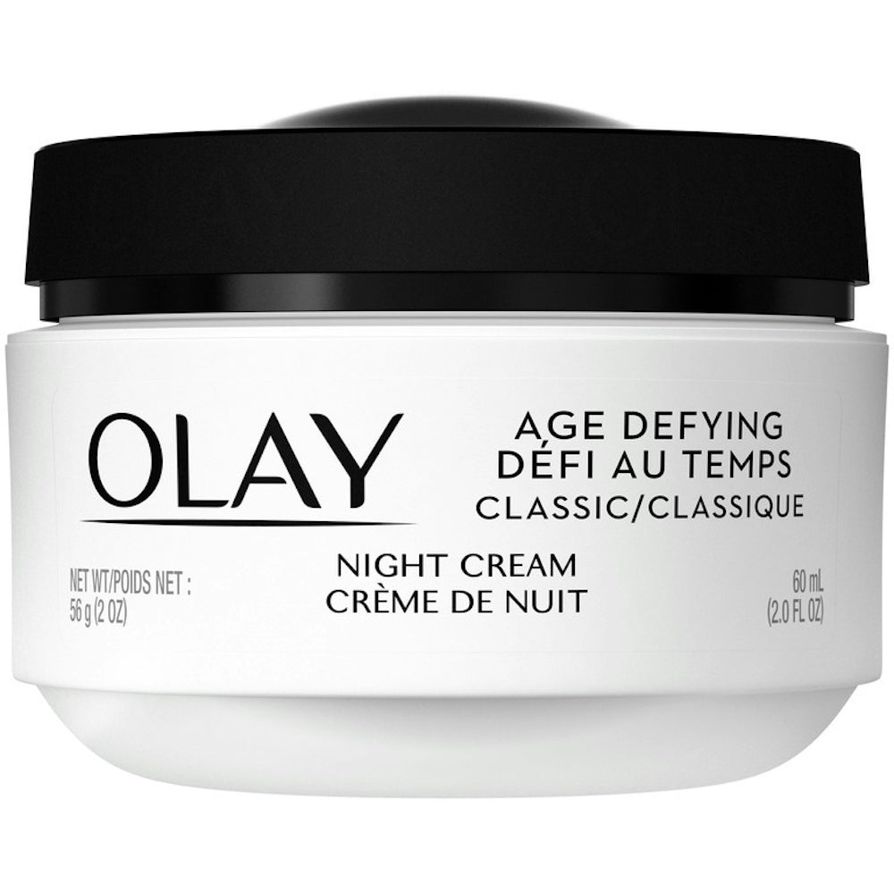 Olay Age Defying Classic Night Face Cream in 2 fl oz jar, shown in a health and beauty product image