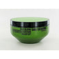 Shu Uemura Silk Bloom Restorative Treatment for hair, in a sleek bottle, designed to nourish and restore hair health.