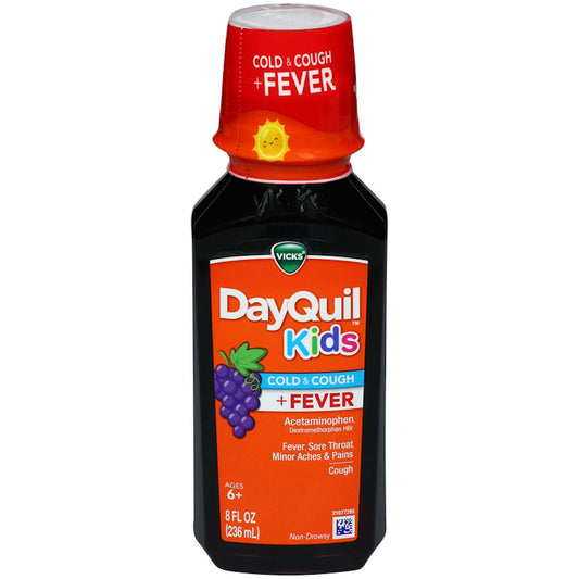 Vicks DyQl Kids Lq cough syrup bottle, 236ml, with label showing dosage of 10-325mg, in a health and beauty product setting