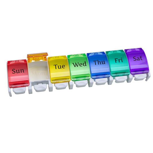 Ezy Dose Weekly Pill Organizer with push buttons by Pasteur Pharmacy, showing a compact plastic medication case with labeled compartments.