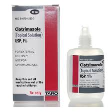 Clotrimazole Topical Solution USP 1% in a 10ml bottle, used for treating fungal infections, displayed with a medical background.
