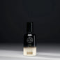 Oribe Balm d'Or Heat Styling Shield 100ml bottle, protective spray for heat styling, with sleek design and pump nozzle.