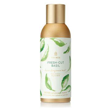 Thymes Fresh-Cut Basil Home Fragrance Mist in 85g spray bottle, natural basil scent for freshening indoor spaces.