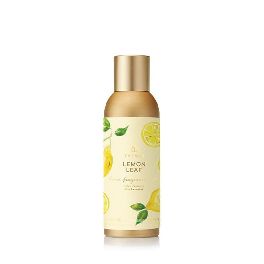 Thymes Lemon Leaf home fragrance mist in a clear glass bottle with a white spray nozzle, designed for refreshing home ambiance.