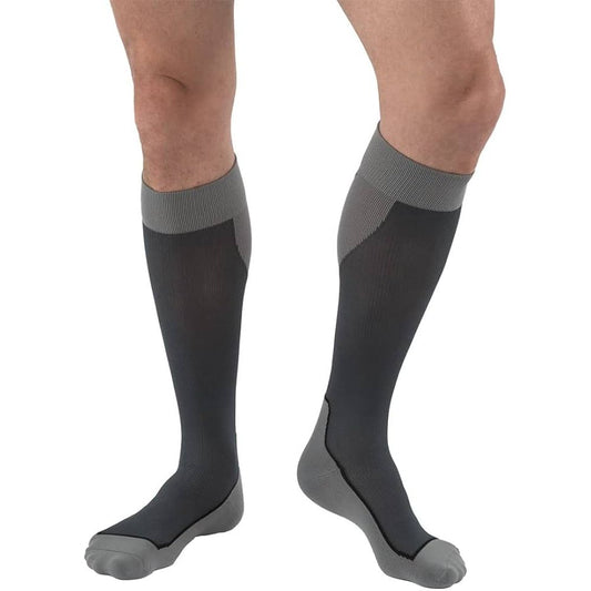 Unisex GNP knee-high compression socks in black and grey stripe, size small, with 15-20 mmHg compression, by Pasteur Pharmacy.