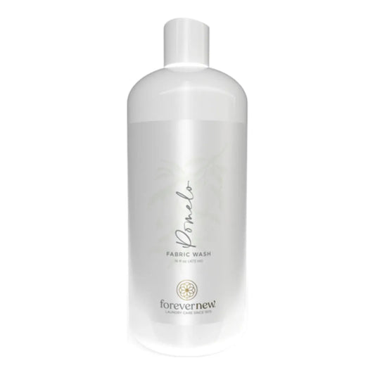 Forever New Pomelo Fabric Wash laundry detergent bottle from Pasteur Pharmacy, 16 oz, designed for gentle fabric cleaning.