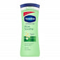 Vaseline Intensive Care Essential Healing Body Lotion in 10 oz bottle, moisturizing and nourishing skin with creamy lotion.