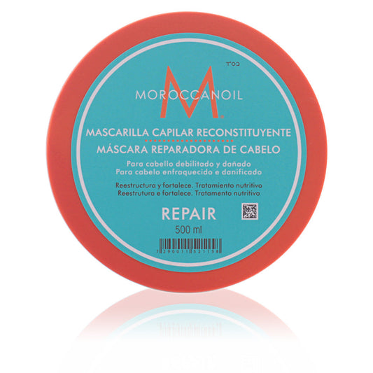 Moroccanoil Repair Restorative Hair Mask in 500ml jar, nourishing treatment for damaged hair, shown in a professional hair care setting.