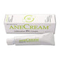 Anecream 4% ointment in a 1oz tube displayed on a medicine cabinet shelf, suitable for topical skin treatment.