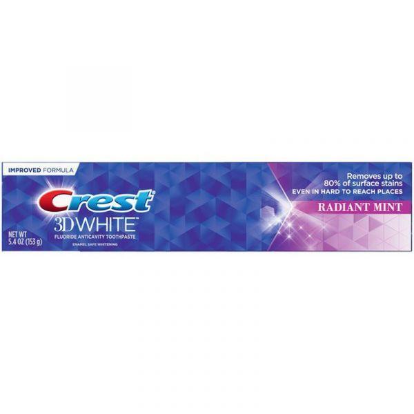 Crest 3D White Radiant Mint Toothpaste 5.4 oz tube inside a medicine cabinet, showing packaging and mint-flavored whitening formula