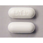 Good Neighbor Pharmacy GNP Acetaminophen 500 mg caplets in a Pasteur Pharmacy medicine cabinet, 50-count bottle.