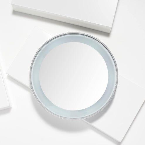 Tweezerman LED 15X Mini Mirror showing a compact, lighted mirror with magnification, ideal for detailed grooming.
