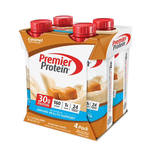 Premier Protein High Shake in Caramel flavor, 4-pack, nutrition drinks and shakes by Pasteur Pharmacy, showing bottles on a table.