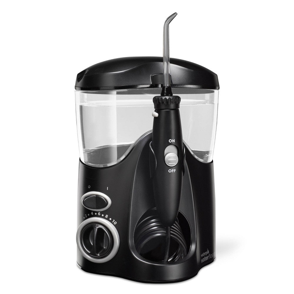Black Waterpik Ultra countertop water flosser WP-112 for oral care, showing the device with a water reservoir and nozzle attachment.