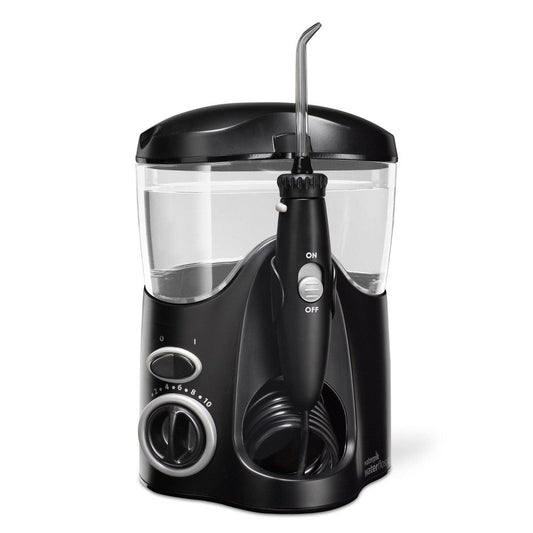 Black Waterpik Ultra countertop water flosser WP-112 for oral care, showing the device with a water reservoir and nozzle attachment.