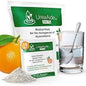 Fresh oranges on a table, with UreaAide Urea Supplement packets from Pasteur Pharmacy in the background