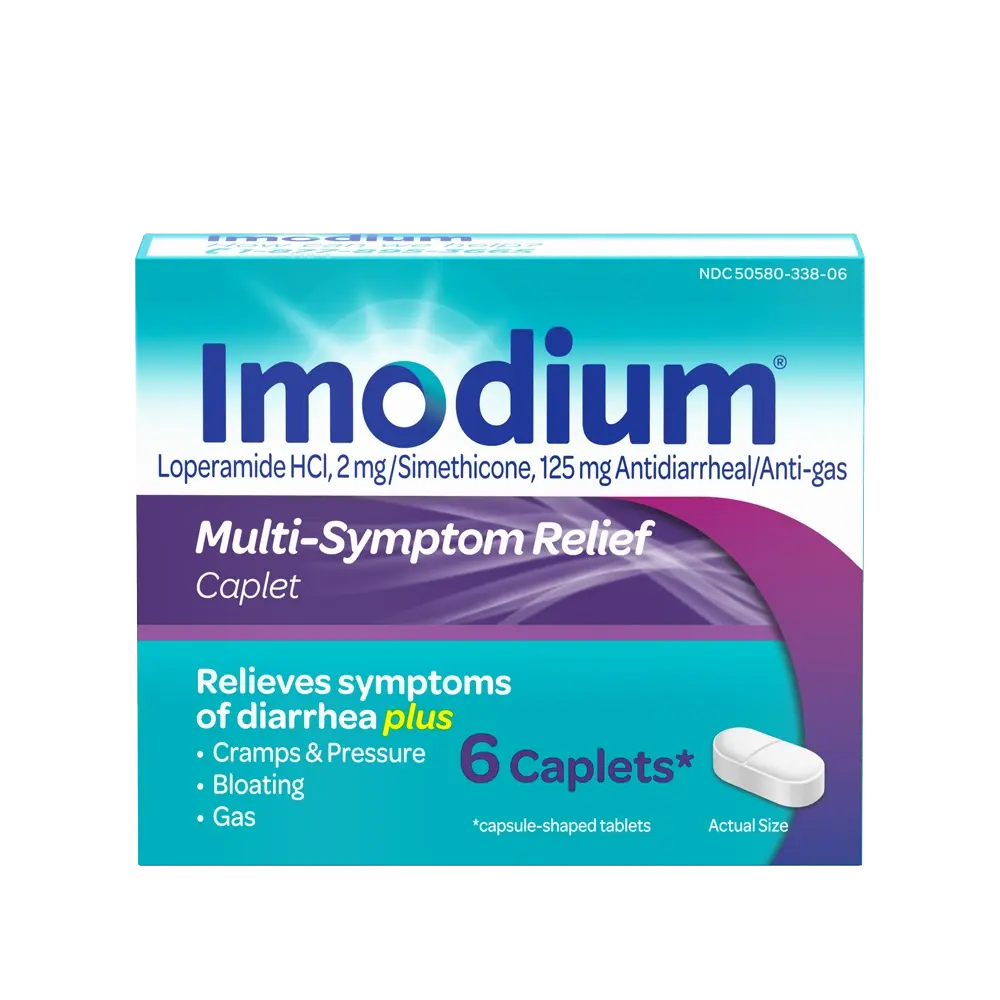 Imodium Multi-Symptom Caplets in a 6-count package, used for digestive relief, placed outdoors with natural lighting.
