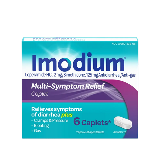 Imodium Multi-Symptom Caplets in a 6-count package, used for digestive relief, placed outdoors with natural lighting.