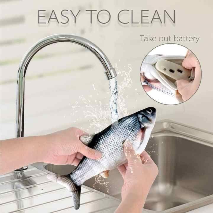 Red plush Vida Smart interactive wagging fish cat toy by Pasteur Pharmacy with realistic movement and USB rechargeable fun for cats.