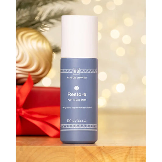 Henson Shaving Restore Post-Shave Balm in 100ml bottle, featuring creamy texture and soothing ingredients for skin after shaving