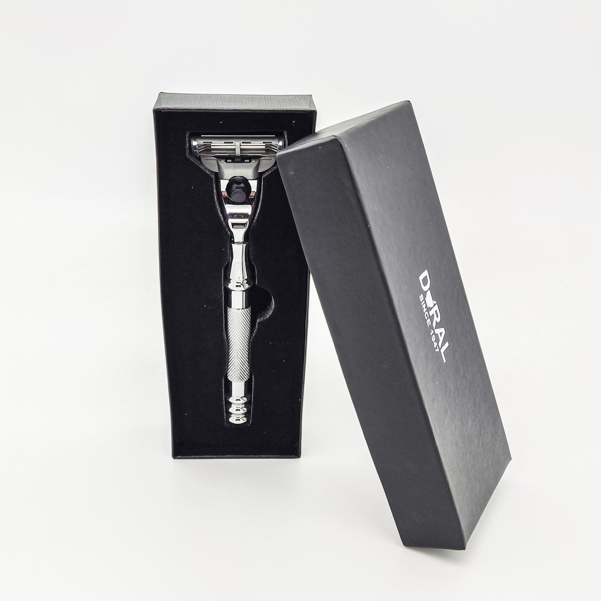 Dural Groose Mach 3 compatible razor with protective pouch by Pasteur Pharmacy, featuring a sleek handle and razor head.